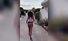 Ebony gurl taking off underwear in the streets